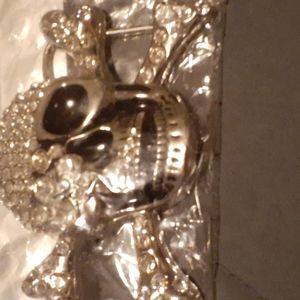 Silver & Black Skeleton Head belt buckle with clear stones.